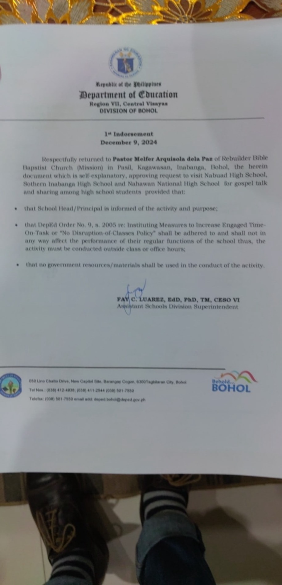 Signed first indorsement from the Department of Education to Pastor Melfer dela Paz of Rebuilder Bible Baptist Church Mission, approving gospel visits to three Inabanga high schools