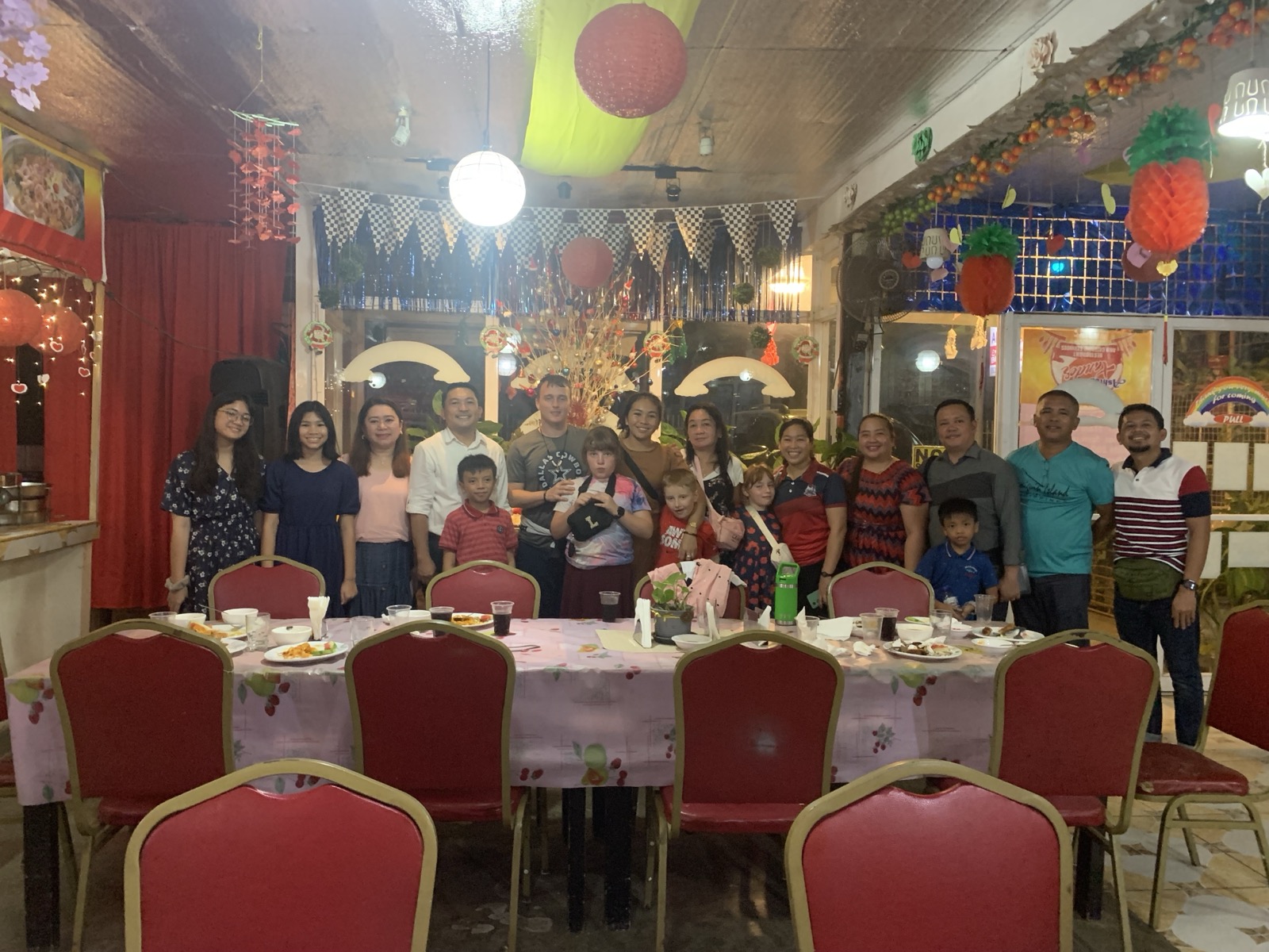 The Schneide family and Bohol church members gathered for a meal after a day of school ministry