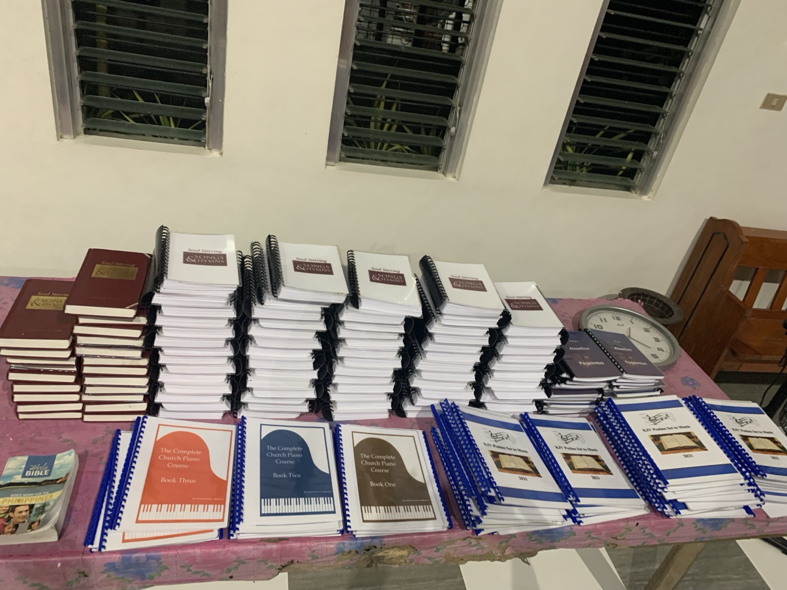 Stacks of new hymnals and Christian music songbooks delivered to a Bohol Baptist church